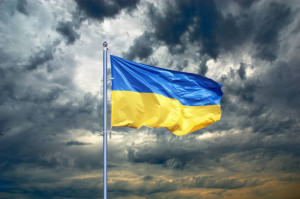 Ukraine flag. Ukrainian flag on black storm cloud sky. stormy weather