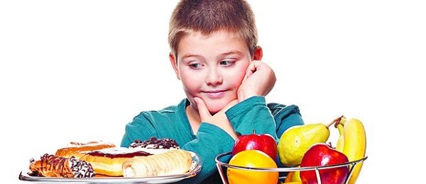a boy's choice of a healthy or unhealth snack