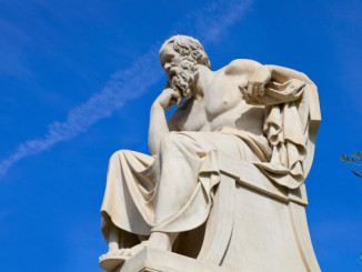 Stone statue of Socrates on a sunny day
