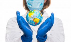 doctor-holding-a-world-globe-in-her-hands-concept-of-world-health-picture-id1219620675-768x460