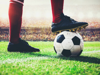 soccer football player tread on the ball at kick off line