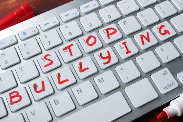 depositphotos_142346940-stock-photo-words-stop-bullying-written-on