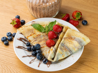 Crêpe,Desert,With,Fresh,Fruits,And,Some,Stripes,Of,Chocolate.