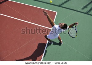 stock-photo-young-man-play-tennis-outdoor-on-orange-tennis-field-at-early-morning-59311696