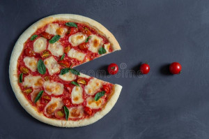pacman-pizza-margarita-devours-cherry-tomatoes-pacman-pizza-margherita-black-background-157515530